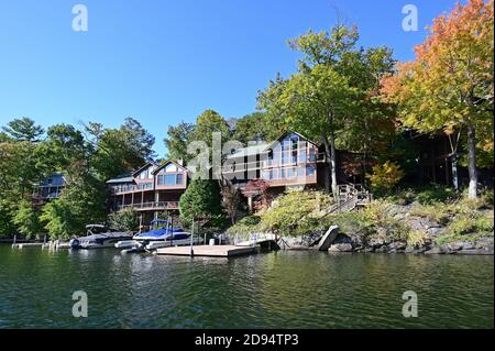 Lake Santeetlah, North Carolina - October, 2020 - Lake homes on lakeshore in autumn. Stock Photo