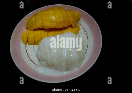 Mango and Sticky Rice Thai dessert. Stock Photo