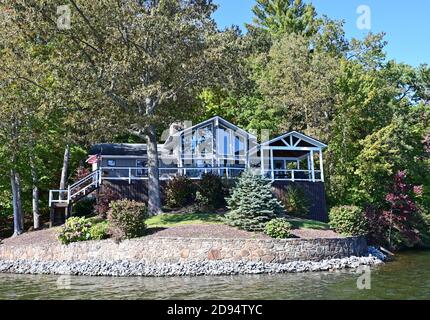 Lake Santeetlah, North Carolina - October, 2020 - Lake homes on lakeshore in autumn. Stock Photo