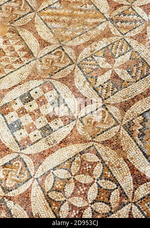 The texture of the mosaic of the lined floors in the baths Herod's palace in the Caesarea Primorskaya national park. Stock Photo