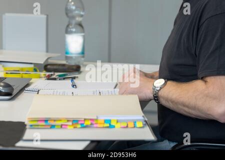 Man with file folder on the desk Stock Photo