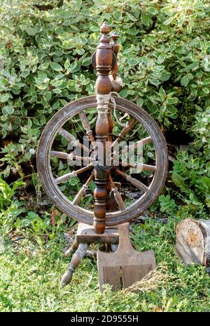An old wooden spinning wheel Stock Photo - Alamy