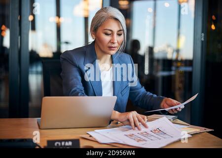 Charming female architect working on project in office Stock Photo