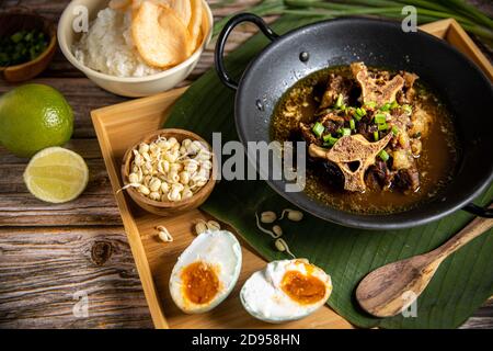 Oxtail Soup or Sop Buntut. Indonesian own Beef Stew Traditional Food Stock Photo