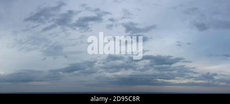 Panorama of gloomy autumn gray sky. Stock Photo
