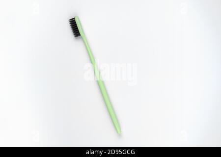 Photo of green toothbrush on isolated white background Stock Photo