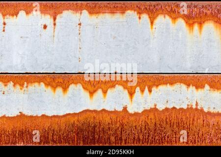 Orange rust patterns on a galvanised steel metal surface Stock Photo