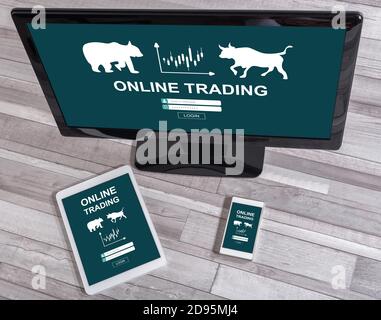 Online trading concept shown on different information technology devices Stock Photo
