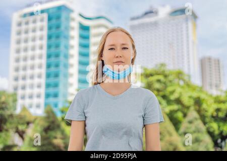 Improper wearing of mask concept. Woman wearing mask wrong Stock Photo