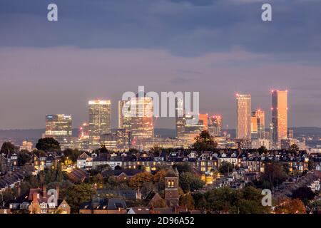 UK, England, London, skyline view from Muswell Hill of downtown London with suburban housing in Crouch End and the Canary Wharf CBD in Docklands, dusk Stock Photo