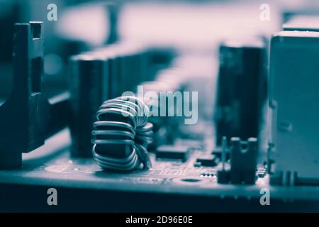 Blue electronic mother board circuit close up macro background. Stock Photo