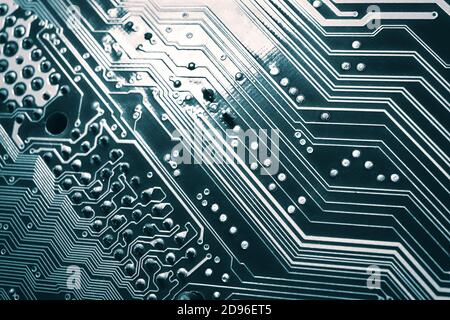 Blue electronic mother board circuit close up macro background. Stock Photo