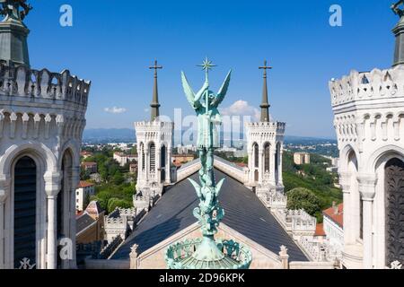 Lyon (central-eastern France): built in 1896 on the Fourviere Hill, the Basilica of Notre-Dame de Fourviere overhangs the city. Here, the statue of Sa Stock Photo
