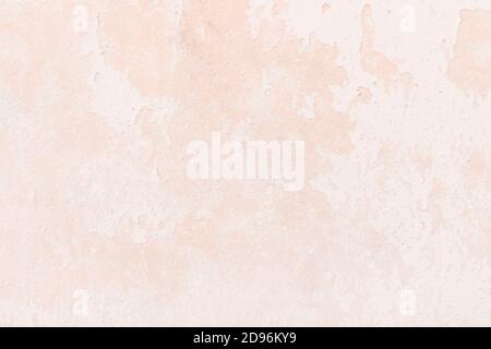 Pale pink weathered wall close up background Stock Photo