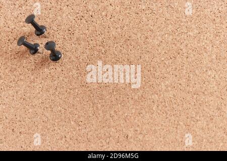 Cork board texture with black push pins Stock Photo