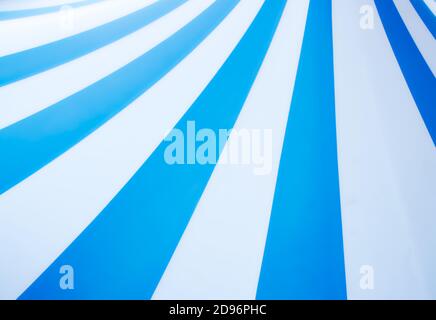 Abstract vintage pop art background design with thick blue and white stripes with copyspace for text Stock Photo