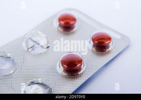 Close-up of a red pills in blister pack Stock Photo
