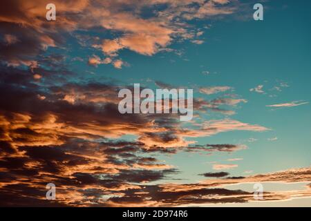 Blue sky with dramatic orange cloud formation Stock Photo