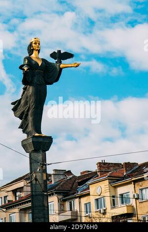 Saint Sofia (Sophia) monument in Sofia, Bulgaria. City monument and landmark. A bronze and gold statue of woman. Stock Photo