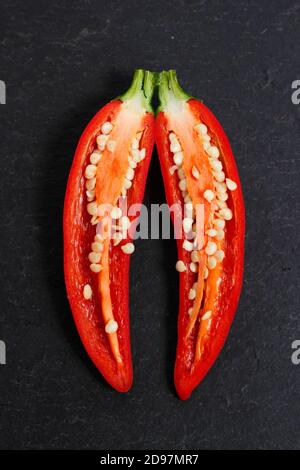Homegrown jalapeno chilli peppers sliced open to reveal seeds. UK Stock Photo