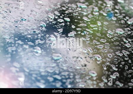 Raindrops on the glass of the car. Selective focus. Stock Photo