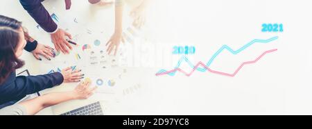 Business people discussing development year 2021 goal concept, Businessman pointing graph corporate future growth up plan from 2020 Stock Photo