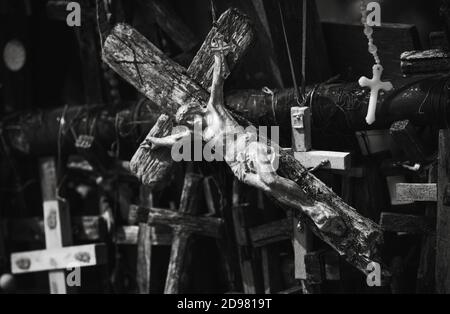 Crucifixion of Christ and a large number of crosses at Hill of Crosses. Hill of Crosses is a unique monument of history and religious folk art in Siau Stock Photo