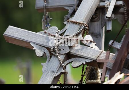 Crucifixion of Christ and a large number of crosses at Hill of Crosses. Hill of Crosses is a unique monument of history and religious folk art in Siau Stock Photo