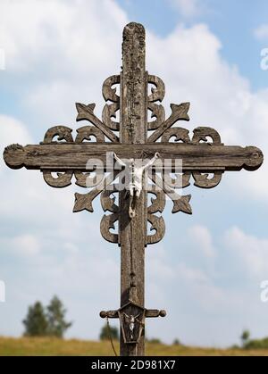 Crucifixion of Christ and a large number of crosses at Hill of Crosses. Hill of Crosses is a unique monument of history and religious folk art in Siau Stock Photo