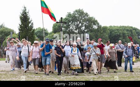 SIAULIAI, LITHUANIA - JUL 28, 2019: Pilgrims on the religious event on the Hill of Crosses. Hill of Crosses is a unique monument of history and religi Stock Photo