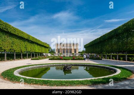 Versailles, France - August 28, 2019 : Tourists near the Petit Trianon and the French Garden in the parc de Versailles Palace. Stock Photo