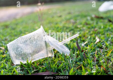 PVC cups litter on public park pose danger to environment Stock Photo