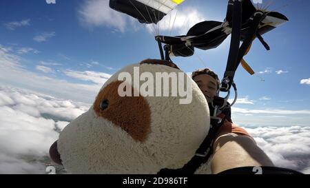 Skydiving Teddy Bear extreme sports Stock Photo