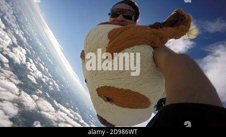 Skydiving Teddy Bear extreme sports Stock Photo