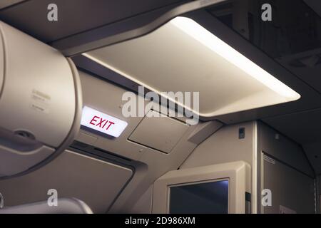emergency exit sign and toilet sign on airplane Stock Photo