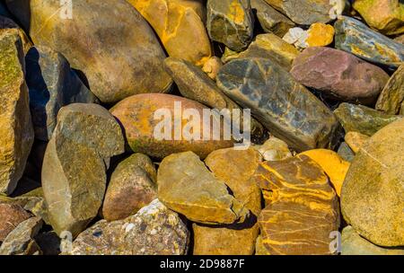 very small and tiny pebble stone rocks in macro close up in diverse colors  garden ground decoration background Stock Photo