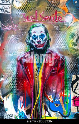 Mural of the Joker with text saying 'Just Smile' in Soho, London, UK Stock Photo