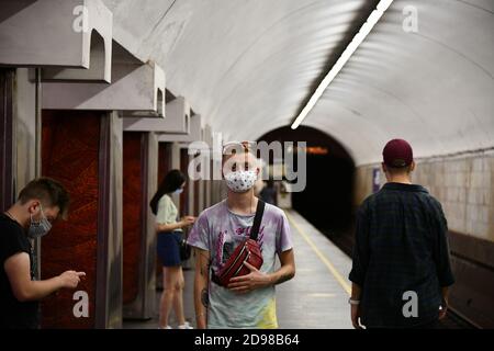 Kyiv, Ukraine - September 13, 2020: Passengers in subway wearing protective masks in accordance with the requirements of health measures Stock Photo