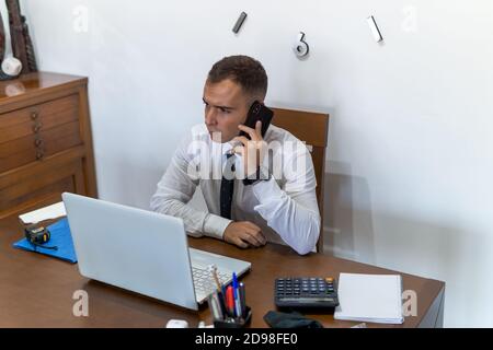 Young businessman working from home Stock Photo