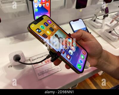 Orlando, FL/USA - 10/25/20: People waiting in line at the Apple retail store  to look at and possibly purchase the new iPhone 12 and 12 Pro smartphones  Stock Photo - Alamy