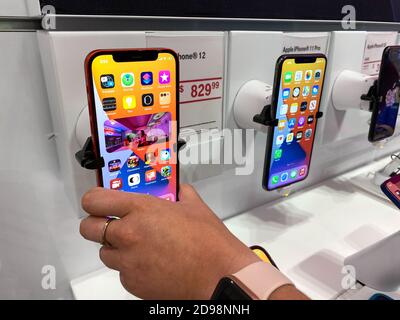 Orlando, FL/USA - 10/25/20: People waiting in line at the Apple retail store  to look at and possibly purchase the new iPhone 12 and 12 Pro smartphones  Stock Photo - Alamy