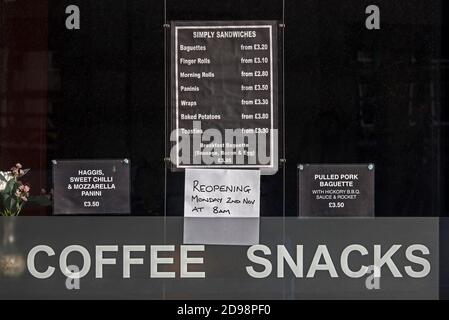 Notice in the window of a Cafe in Edinburgh reopening after lockdown during the covid-19 pandemic. Stock Photo