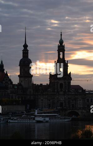 Dresden, Germany. 03rd Nov, 2020. The Ständehaus (l-r), the Hausmannsturm and the catholic court church stand out as silhouettes at sunset. Credit: Sebastian Kahnert/dpa-Zentralbild/ZB/dpa/Alamy Live News Stock Photo