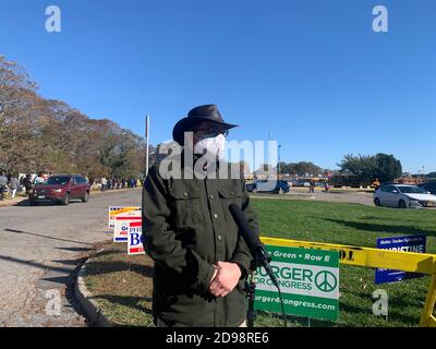 New York, USA. 31st Oct, 2020. Harry R. Burger, who is running for Congress under less-known Green Party in New York's 2nd congressional district, talks with Xinhua at the early voting site of Babylon Town Hall Annex on Long Island of New York State, the United States, Oct. 31, 2020. TO GO WITH 'Feature: U.S. third-party candidate fights for party's survival, urging election reform' Credit: Wei Ying/Xinhua/Alamy Live News Stock Photo