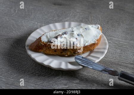 Slice of Sourdough with cream cheese and raisins Stock Photo