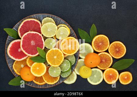Mediterranean healthy citrus fruit  for immune boost with oranges, lemons, limes & grapefruit high in antioxidants, anthocyanins, lycopene & vitamins. Stock Photo