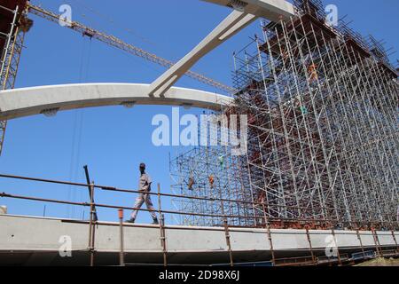Klein Karoo, South Africa, March 7, 2020: Large construction site besides the country road. Building workers. In the semi-desert Klein Karoo. Africa. Stock Photo
