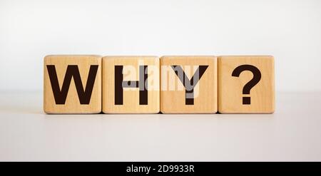 Concept word 'why' on wooden cubes on a beautiful white background. Business concept, copy space. Stock Photo