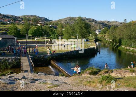 River beach in Albergaria da Serra full of tourists in Serra da Freita Arouca Geopark, in Portugal Stock Photo