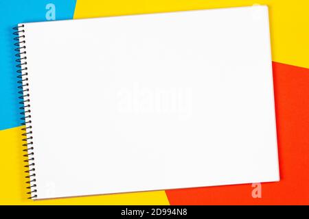 Empty open white sketchbook with space for text on geometric minimal background. Creative mockup. Top view Stock Photo